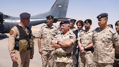 Jordan's King Abdullah, centre, says the overhaul will improve government services. AFP