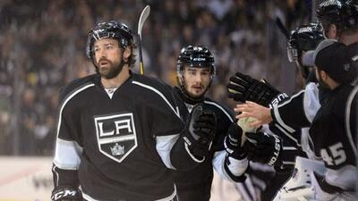 Slava Voynov, centre, powered his Los Angeles Kings to Game 3 victory. Harry how / Getty Images / AFP