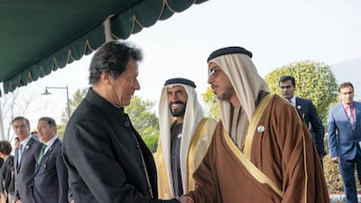 ISLAMABAD, PAKISTAN - January 06, 2019: HH Sheikh Mansour bin Zayed Al Nahyan, UAE Deputy Prime Minister and Minister of Presidential Affairs (R), greets HE Imran Khan, Prime Minister of Pakistan (L), at the Prime Minister's residence. Seen with HH Sheikh Nahyan Bin Zayed Al Nahyan, Chairman of the Board of Trustees of Zayed bin Sultan Al Nahyan Charitable and Humanitarian Foundation (2nd R). ( Mohammed Al Hammadi / Ministry of Presidential Affairs ) ---