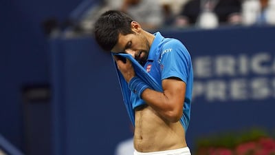 Novak Djokovic of Serbia reacts to losing a point against Stan Wawrinka of Switzerland. Jewel Samad / AFP