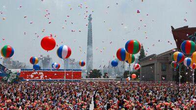 Celebratory balloons met Mr Putin during his welcoming ceremony. EPA / Sputnik