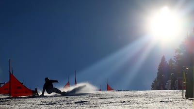 Russia's Dmitry Loginov in action during the men's parallel giant slalom at the FIS Snowboard Alpine World Championship in Rogla, Slovenia, on Tuesday, March 2. Reuters