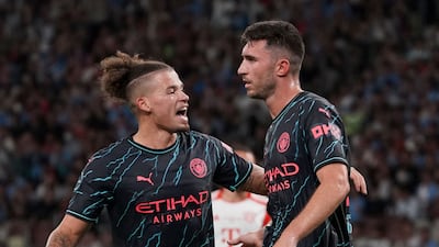 Manchester City's Aymeric Laporte, right, celebrates scoring the winner with teammate Kalvin Phillips in the 2-1 pre-season friendly victory against Bayern Munich at the National Stadium in Tokyo on July 26, 2023. AFP