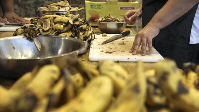 Volunteers chopping more banana skins to cook for dessert, credit Peter Yeung.jpg
