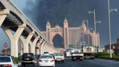 The large arched entrance to the Atlantis hotel is seen after a fire broke out on Sept 2. The fire at the hotel, which is expected to open in mid September, broke out on Tuesday morning.