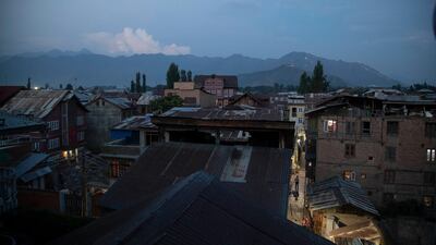 A Kashmiri man walks in a narrow alley during lockdown to control the spread of the coronavirus in downtown Srinagar, Indian controlled Kashmir. AP