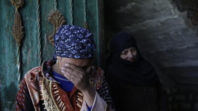 Relatives of abducted Coptic Christian Samuel Walham, one of 21 Coptic Egyptian men seized by ISIL militants in the central city of Sirte, Libya, more than a month ago, weep outside their home in the village of el-Aour, near Minya. Hassan Ammar / AP