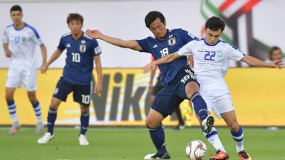 Shiotani fights for the ball with Nikita Gorbunov. AFP