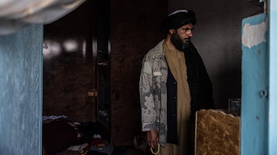 A Taliban fighter inspects an empty room at Pul-e-Charkhi prison. Stefanie Glinski for The National