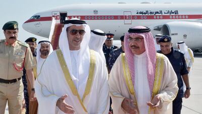 Sheikh Saif bin Zayed, Deputy Prime Minister and Minister of the Interior, is welcomed by Sheikh Rashid bin Abdulla Al Khalifa, Bahraini Interior Minister, upon landing in Bahrain. Wam