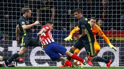 Jose Gimenez scores Atletico Madrid's first goal. Reuters