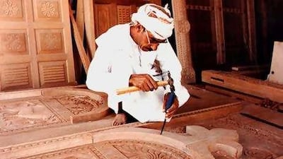 A master carver in his workshop in Oman's Nizwa town. Once in demand by royalty, the trade's future is in doubt.