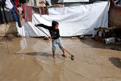 A clear-up after heavy winter rain compounded the suffering of displaced Palestinians crammed into makeshift shelters in Khan Younis, southern Gaza. Reuters