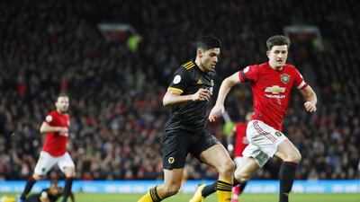 Wolves' Raul Jimenez (L) in action against Manchester United Harry Maguire. EPA