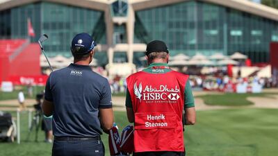ABU DHABI, UNITED ARAB EMIRATES - JANUARY 21: Henrik Stenson of Sweden talks to caddie Gareth Lord on the 9th hole during the first round of the Abu Dhabi HSBC Golf Championship at The Abu Dhabi Golf Club on January 21, 2016 in Abu Dhabi, United Arab Emirates. (Photo by Andrew Redington/Getty Images)