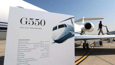 A Gulfstream G550 jet gets a dusting from a worker at the 2014 Abu Dhabi Air Expo at Al Bateen Executive Airport. Delores Johnson / The National
