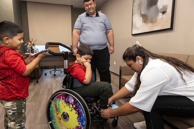 Hulusi Sert with his family. Antonie Robertson / The National
