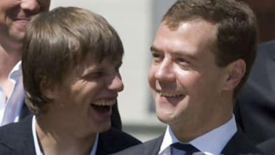 Russian President Dmitry Medevedev, right, and Russia's soccer team's forward Andrei Arshavin are seen at a meeting in Moscow.