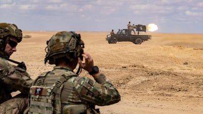 SDF and the US-led coalition troops practise using heavy weapons in north-eastern Syria, where fears are mounting of further attacks by Turkey. AFP