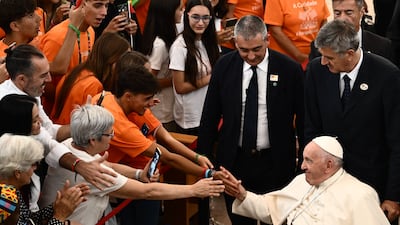 Pope Francis during his visit to the Serafina parish social centre to meet representatives of volunteers and charity centres. AFP