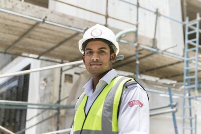 Diya Kayshan, a security guard, received a meal from the Ramadan Sharing Fridges initiative. Reem Mohammed / The National