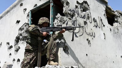 A member of the Afghan security force takes position during an operation against ISIS in Nangarhar province, Afghanistan, in 2017. EPA