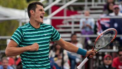 Bernard Tomic of Australia celebrates winning the Colombia Open on Sunday. Juan Jose Horta / EPA / July 20, 2014