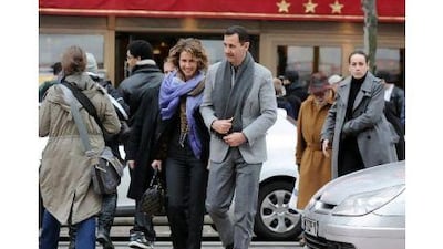 The Syrian president, Bashar al Assad, and his wife Asma walking in a street in Paris during a two-day official visit to France. Switzerland said on May 24, 2011 it has frozen any assets that Mr al Assad may have in the country. Miguel Medina / AFP Photo