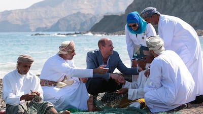 Britain's Prince William meets with Omani fishermen during a visit to Muscat, Oman. REUTERS