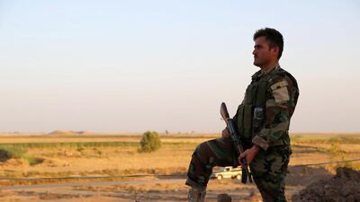 A member of the Iraqi Kurdish forces, known as the Pershmerga, stands guard near Tuz Khurmatu, 70 kilometres south of Kirkuk. Marwan Ibrahim / AFP / June 24, 2014