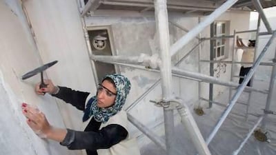 Volunteer Amal Al Muhairi from the Community Development Authority (CDA), repairing the homes of elderly Emiratis who cannot afford to overhaul their houses that badly need renovation. Jaime Puebla / The National