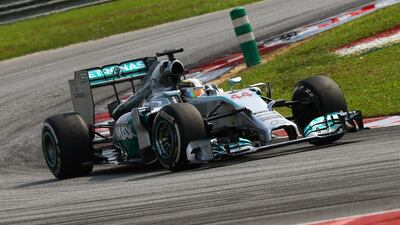 British Formula One driver Lewis Hamilton of Mercedes-GP steers his car through a turn during the Malaysian Formula One Grand Prix at the Sepang International Circuit, near Kuala Lumpur, on March 30, 2014. Srdjan Suki / EPA