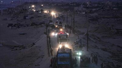 Displaced Palestinians flee northern Gaza along the coastal road near Wadi Gaza. AP