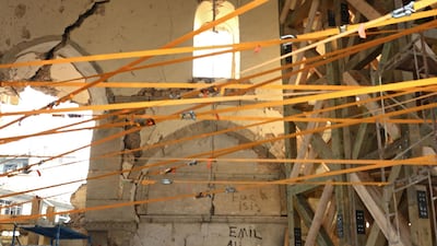 Iraqi workers are seen under the dome of the Great Mosque of Al-Nuri during the complex's reconstruction in Mosul. AFP