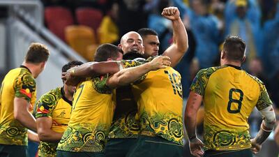 Australia players celebrate after their Bledisloe Cup win over New Zealand in Brisbane on Saturday. Dan Peled / EPA