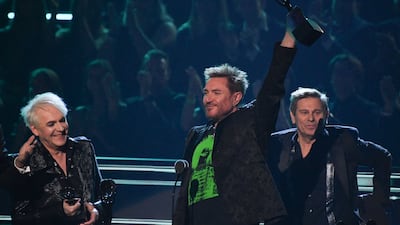 Duran Duran members Nick Rhodes, Simon Le Bon and Roger Taylor onstage during the 37th annual Rock & Roll Hall of Fame Induction Ceremony in Los Angeles, California. AFP