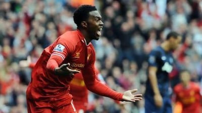 Liverpool's Daniel Sturridge celebrates after scoring against Manchester United at Anfield. Peter Powell / EPA