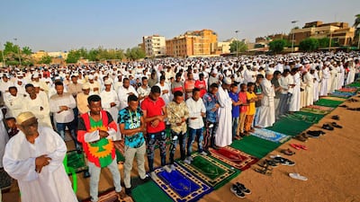 An Imam preaches a sermon to worshippers during Eid Al Fitr prayers in the district of Jureif Gharb of Sudan's capital Khartoum AFP