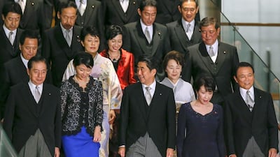 Japanese Prime Minister Shinzo Abe, centre, leads his newly appointed cabinet ministers with veteran ministers at the prime minister's official residence in Tokyo on 3 September 2014 following his cabinet reshuffle. Mr Abe reshuffled his cabinet on Wednesday, in the first reorganisation of his ministerial line-up since coming to power in December 2012. Kimimasa Mayama/EPA