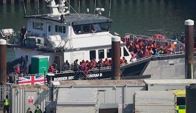 Migrants arriving at the port of Dover after being picked up in the English Channel. PA