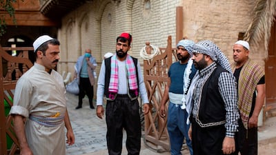 Iraqi actors act out a scene of a parody sketch video adaptation of Bab al-Hara, a long-running iconic Syrian television drama, to raise awareness through videos on the COVID-19 coronavirus pandemic in Iraq's southern port city of Basra on April 22, 2020. AFP / Hussein Faleh