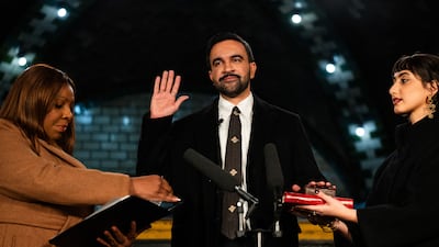 Zohran Mamdani places his hand on a Quran as he is sworn in by New York Attorney General Letitia James alongside his wife, Rama Duwaji. AFP