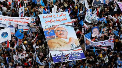 Supporters of Yemen's former president Ali Abdullah Saleh carry his poster during a rally to mark the 35th anniversary of the establishment of his General People's Congress party in Sanaa on August 24, 2017. The poster reads: 'With blood and souls we sacrifice for you oh Yemen'. Khaled Abdullah / Reuters
