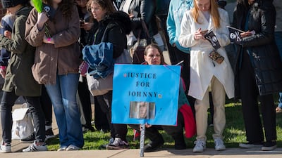 Fans wait for Johnny Depp to arrive before the start of Depp v Heard, outside the courthouse. EPA