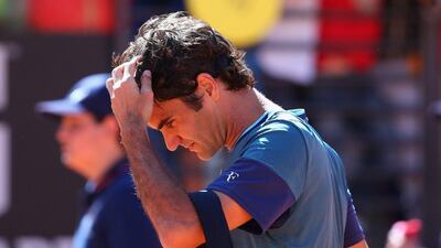 Roger Federer reacts after exiting the Rome Masters at the second round on Wednesday to Jeremy Chardy. Julian Finney / Getty Images / May 14, 2014