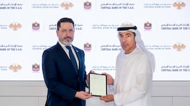 Khaled Balama, governor of the Central Bank of the UAE, right, and Mohammad Raslan, governor of the Central Bank of Syria, during the signing of the preliminary agreement. Photo: UAE Central Bank