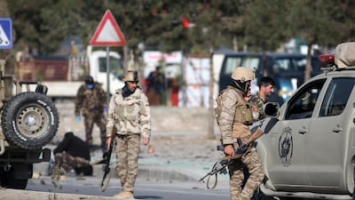 Security personnel inspect a damaged vehicle which was carrying and shooting the rockets, in the aftermath of a rocket attack in Kabul, Afghanistan. According to media reports at least three people were killed and 11 others were injured as multiple rockets landed on the Afghann capital. EPA