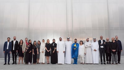 The artists, curators, and mentors of 'Ishara' pose with dignitaries at Concrete, Alserkal Avenue