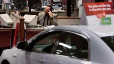 Showrooms like this Manhattan dealership may be quiet, but in the Gulf, cars are still in demand.