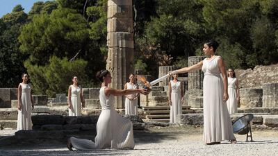 Actress Ino Menegaki, in the role of the High Priestess, lights the torch of the Olympic Flame during the Lighting Ceremony of the Olympic Flame for Sochi Winter Olympics 2014, in front of Hera Temple in Ancient Olympia, Greece. Orestis Panagiotou / EPA